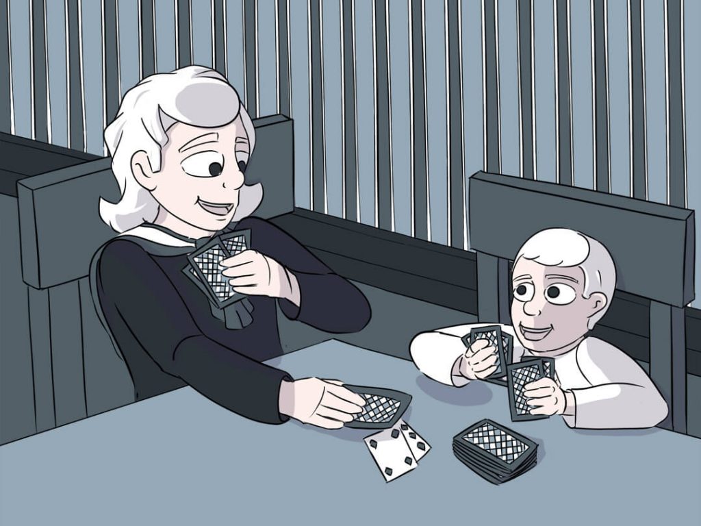 Die beiden Kinder Luise und Mathias aus Harkau spielen gemeinsam Karten